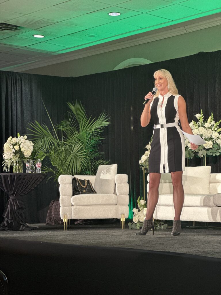 Kristi Standing on the stage and holding a microphone

The Kristi Jones podcast, Coaching can help you see your full potential 
