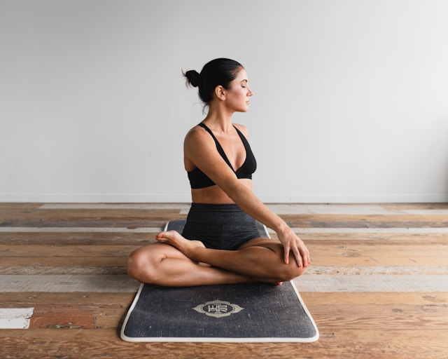 Woman sitting on a yoga mat with her eyes closed and legs crossed with her body slightly turned to the left

The Kristi Jones Podcast - Living Well, Being Well: Your passport to a Fulfilling Life