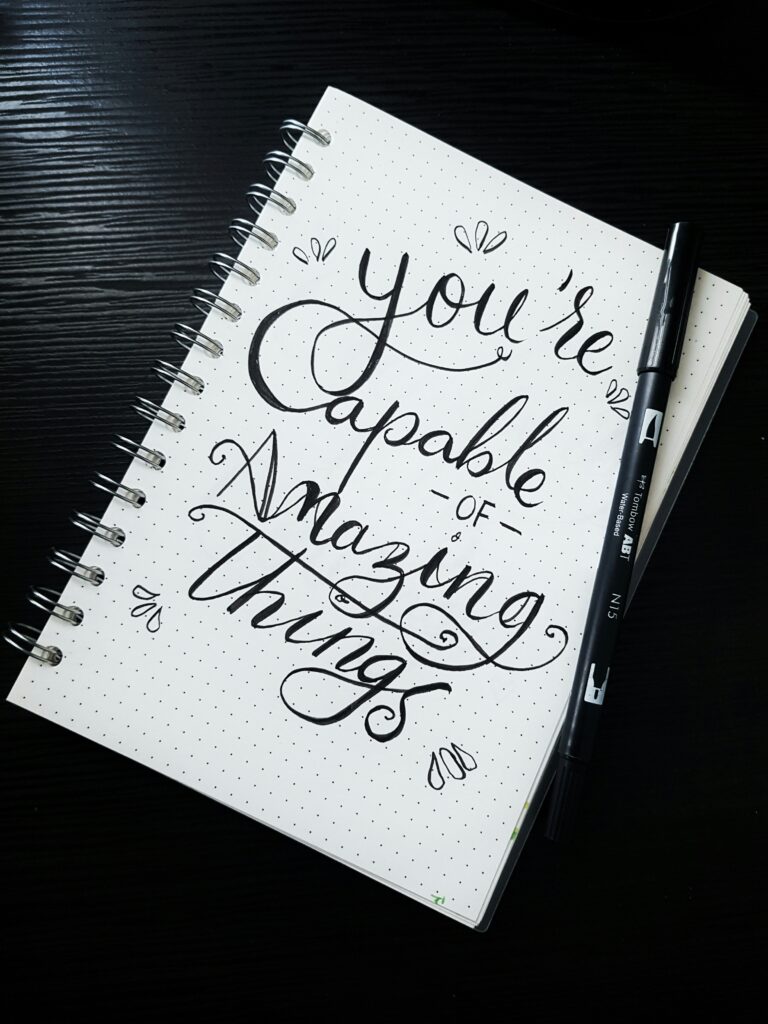 Note book with motivational writings - You are capable of Amazing things

The Kristi Jones Podcast - Be Confident in Your Expectations