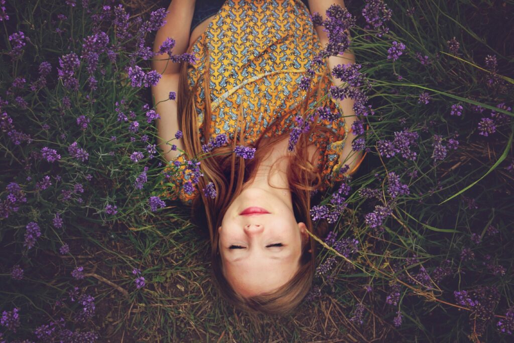 Woman laying on her back with her eyes closed in a relaxing position 

The Kristi Jones Show Podcast - Relax, Friend: Calming your Nervous System and Healing your Body 
