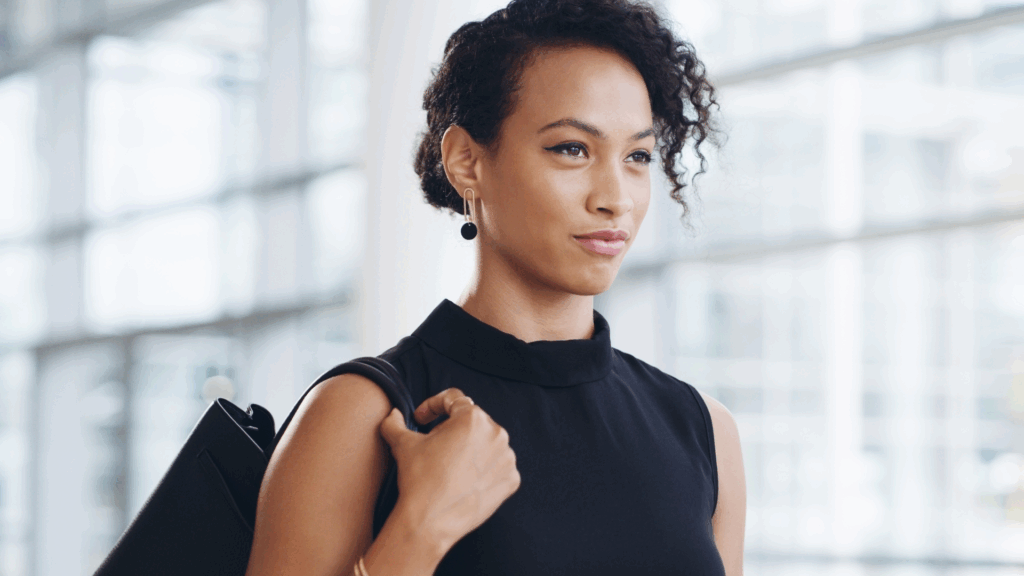 Woman standing tall, looking confident and self-worthy. From Imposter to Empowered: Own Your Unique Path, The Kristi Jones Show Podcast