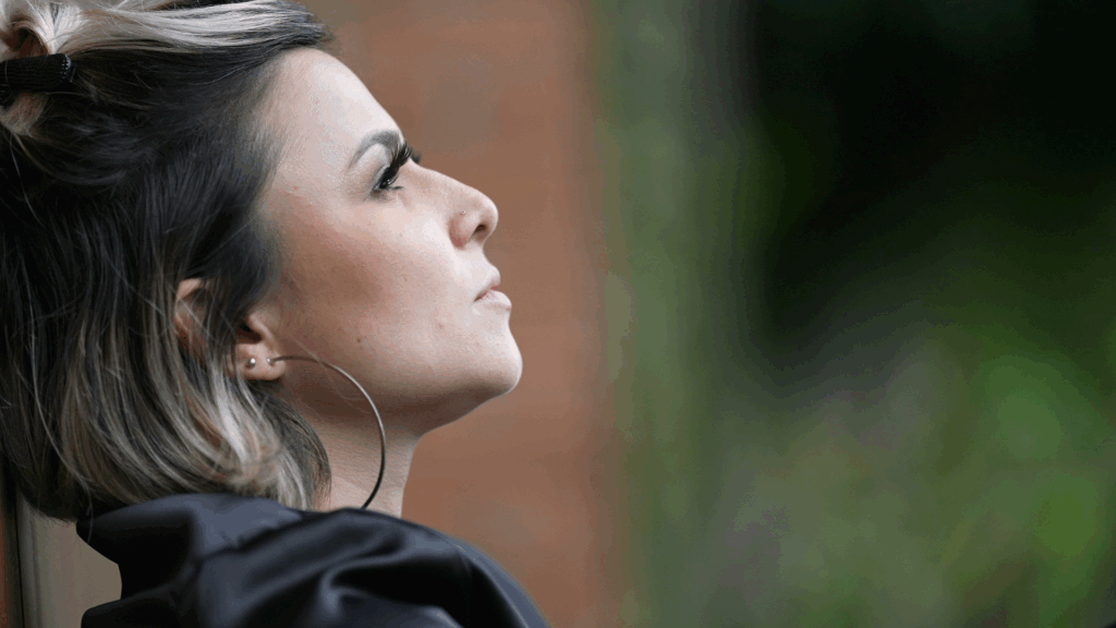 High-achieving professional reflecting; From Imposter to Empowered: Own Your Unique Path, The Kristi Jones Show Podcast