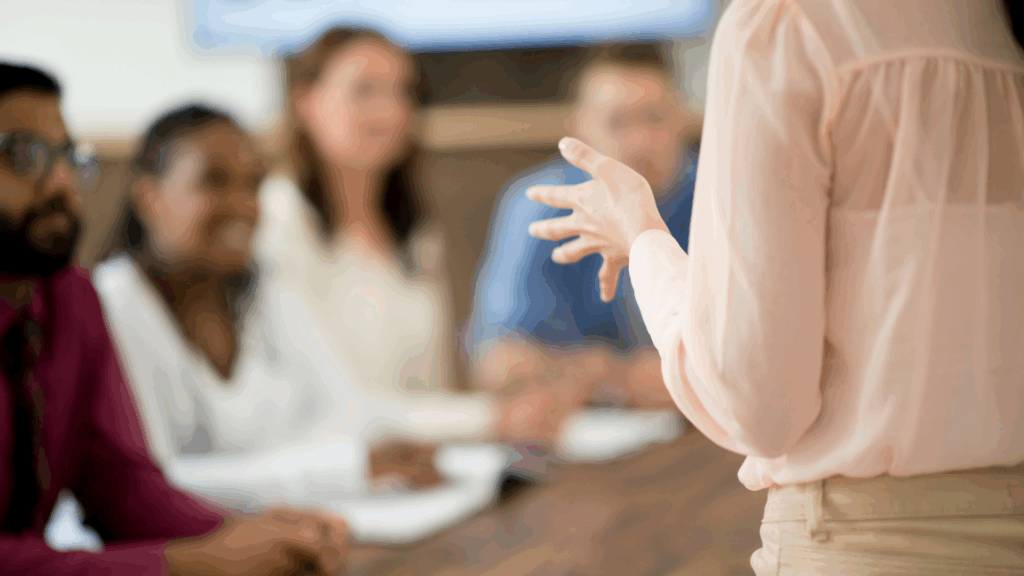 Confident woman leading a meeting - Lead Your Life: Vision, Why, Action - The Kristi Jones Show 