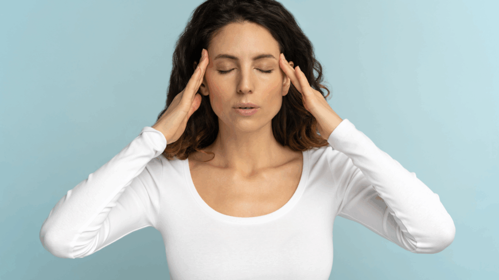 Woman rubbing her head thinking about resetting; The 3-Step Reset to Get Back on Track, The Kristi Jones Show Podcast