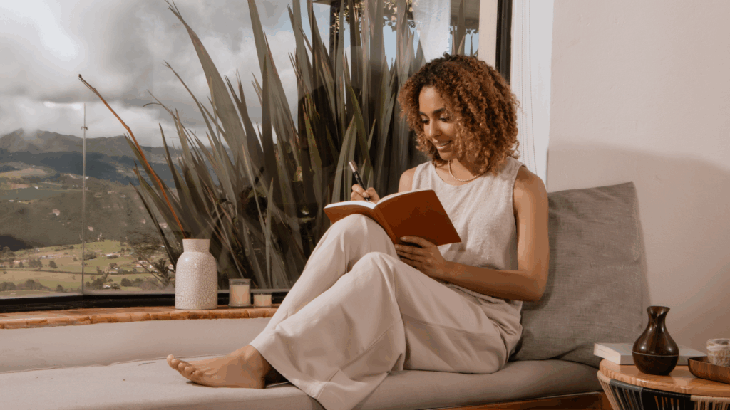 Woman journaling to keep the momentum going, The power of emotional momentum, The Kristi Jones Show Podcast