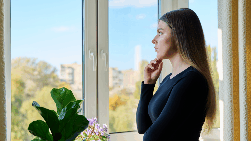 Woman looking pensive because of comparison:  From Comparison to Clarity: Owning Your Unique Path - The Kristi Jones Show 