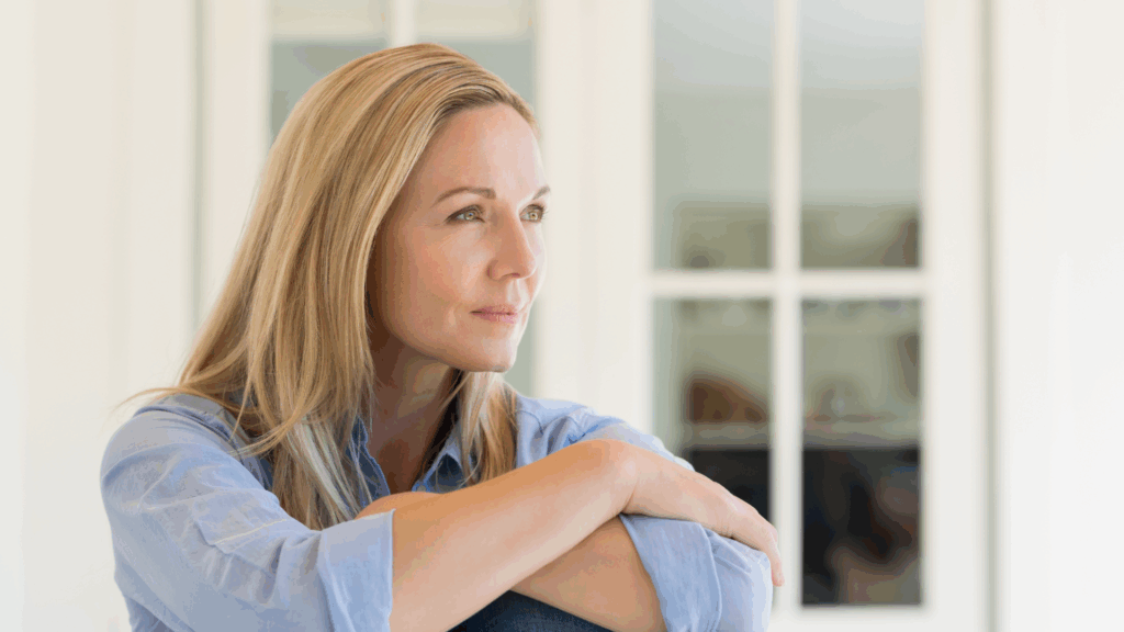 Woman looking serene because of clarity:  From Comparison to Clarity: Owning Your Unique Path - The Kristi Jones Show 